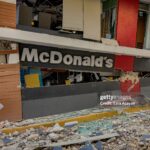 Damaged buildings and cracked roads in Bogo, Philippines, after a 6.9 magnitude earthquake.